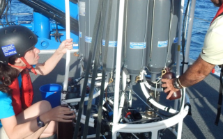 Mara Freilich, left, collecting water that was used to sample different depths of the ocean beneath the research vessel, SOCIB, when Freilich was a graduate student at WHOI/MIT. Credit: Amala Mahadevan