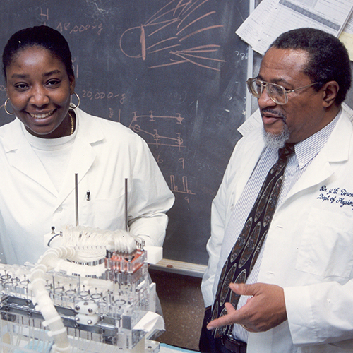 James G. Townsel with student (left)