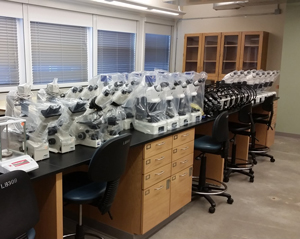 Digital classroom microscope systems lined up for classroom placement. 