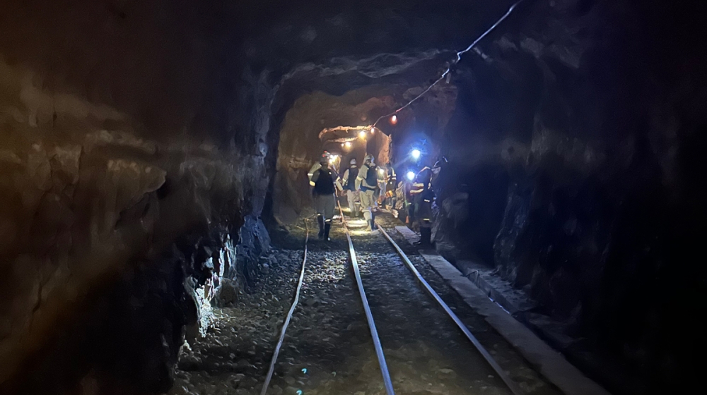 1.	Team of geomicrobiologists walking to a sampling site at the end of an inactive tunnel in a South African gold mine. At this site almost 3 km deep beneath the surface, the researchers can access one of the deepest and oldest ecosystems on Earth. The brines in which these microbes live have been trapped in the rock for more than 1 billion years Credit: Emil Ruff