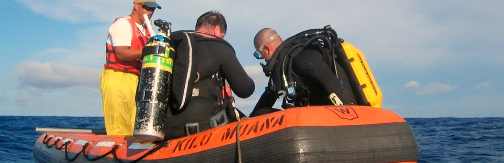 William Browne in scuba gear on a boat