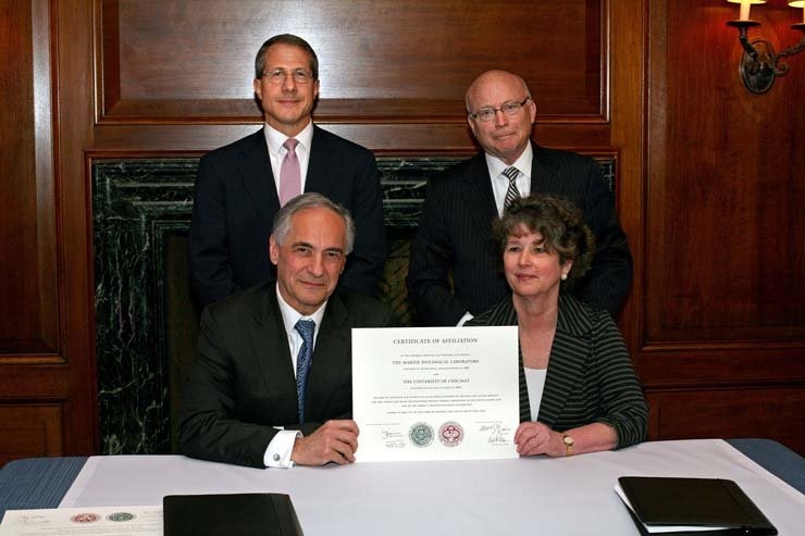 Leaders from the University of Chicago and the Marine Biological Laboratory sign an agreement on June 13, 2013 to form an affiliation between the institutions. Clockwise from top left: University of Chicago Board of Trustees Chairman Andrew Alper; MBL Board of Trustees Chair John W. Rowe; Marine Biological Laboratory President and Director Joan V. Ruderman; and University of Chicago President Robert J. Zimmer.