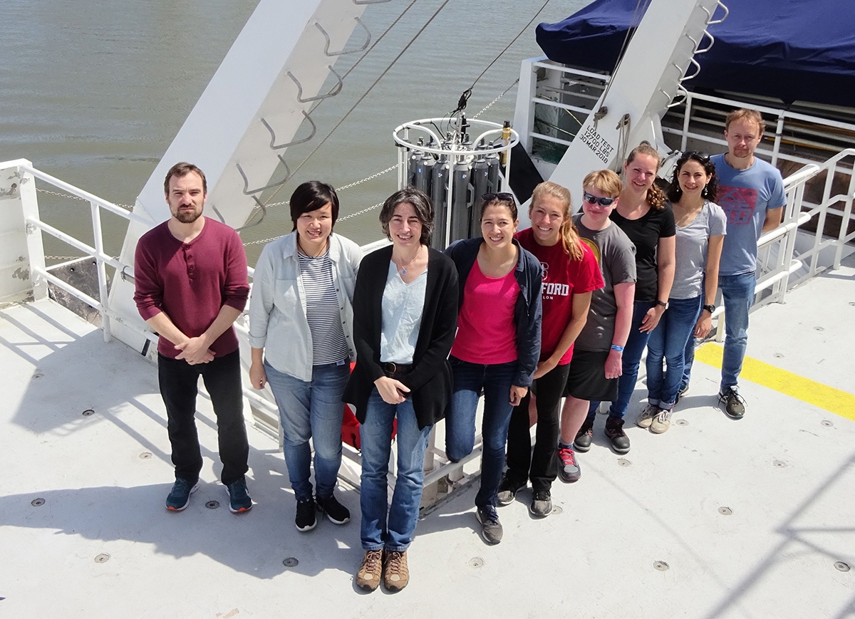 MBL Senior Scientist Alex Worden, front, with her team members from several institutes preparing for a research cruise.