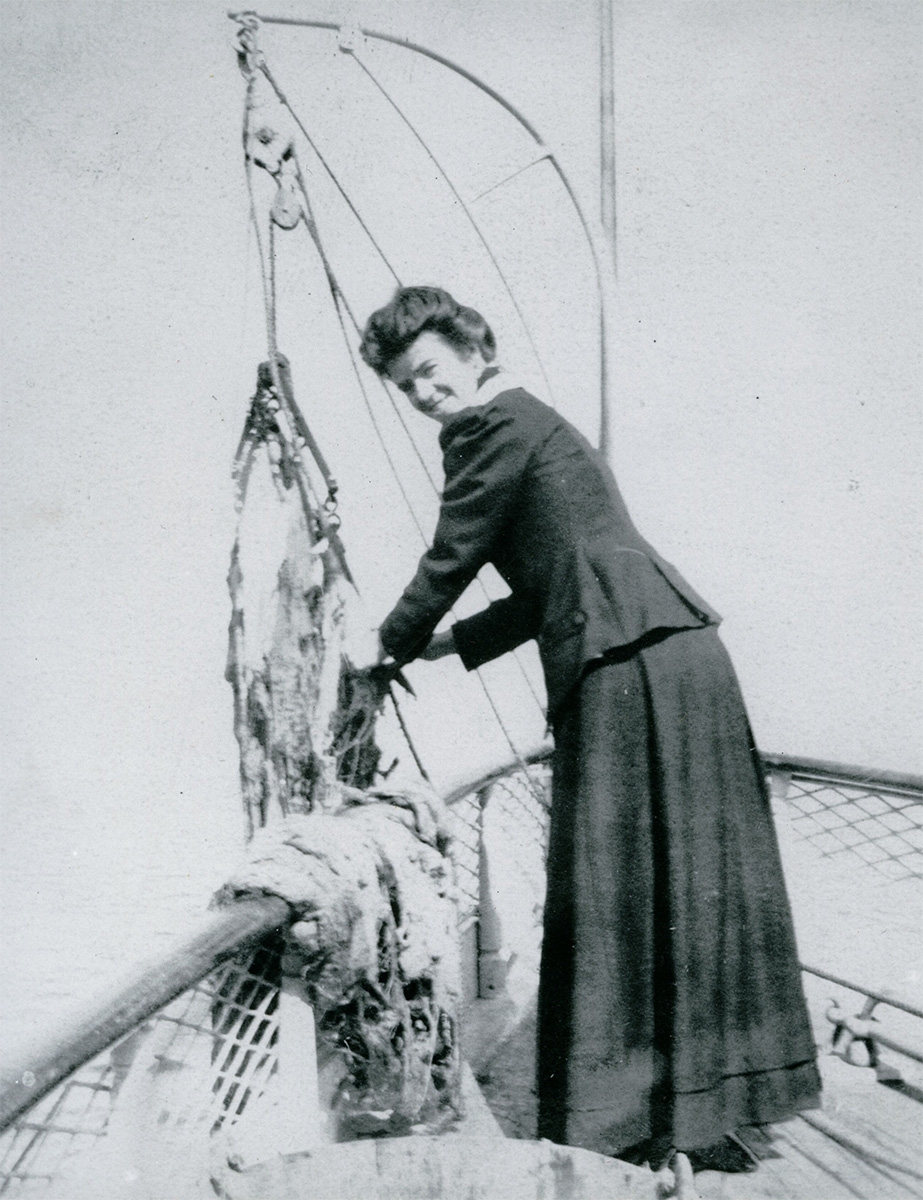 A woman collecting specimens on a boat, 1890