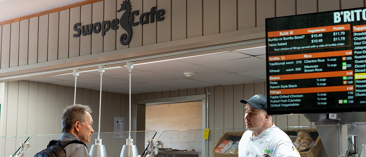 Swope Cafe with customer at counter and worker behind counter