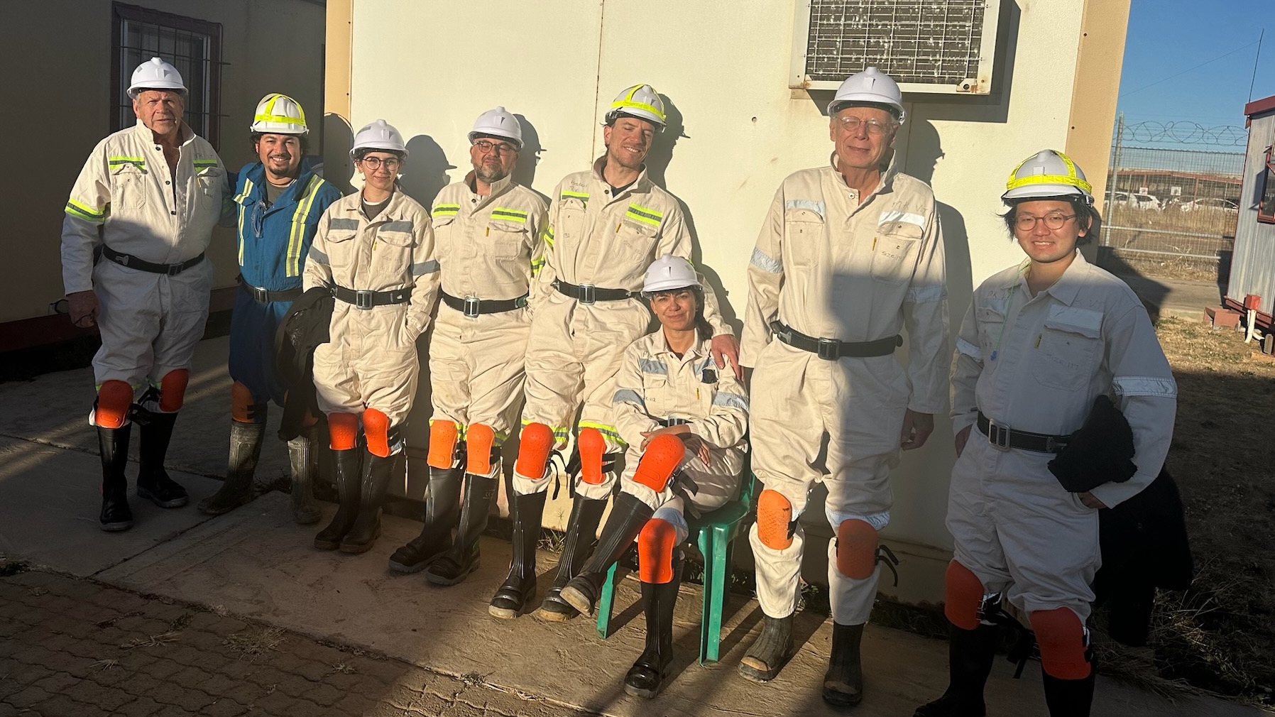 After a day in the damp and dark mine the members of the research team enjoy the sunset and fresh air before returning their borrowed safety outfits, helmets and gear. Courtesy: Emil Ruff